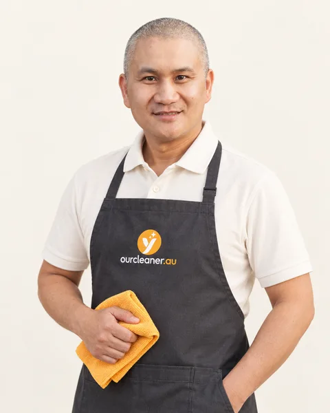 Your Cleaner team member in branded uniform — AI-restyled from his supplied portrait